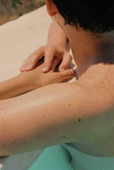 Woman in workout clothes on a blue exercise surface