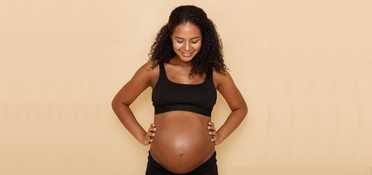 Woman in workout clothes on a blue exercise surface